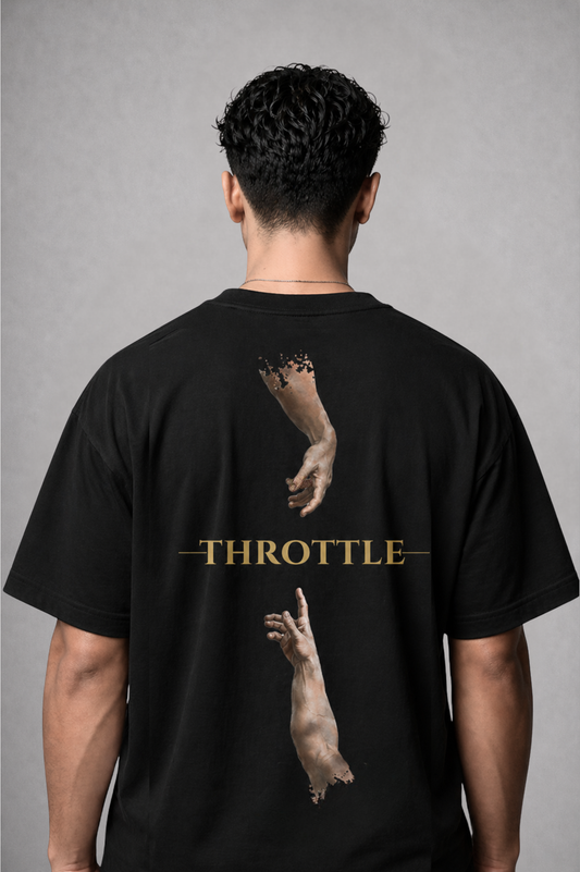 Person wearing a black t-shirt with graphic design and 'THROTTLE' text on the back against a gray background